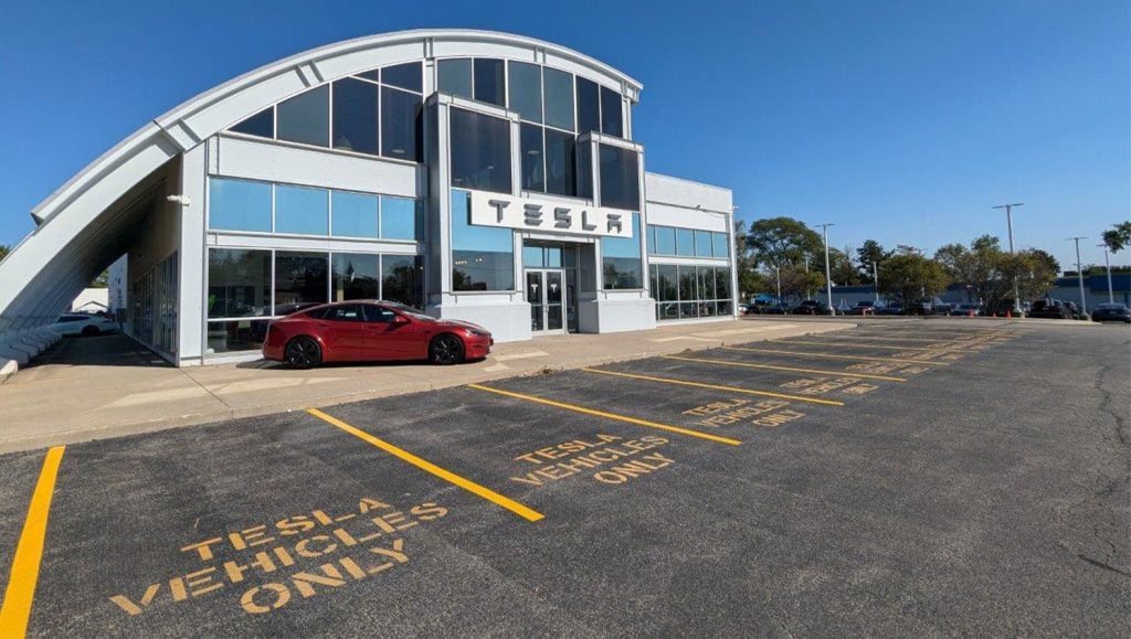 front view of Tesla Dealership with freshly painted parking spots
