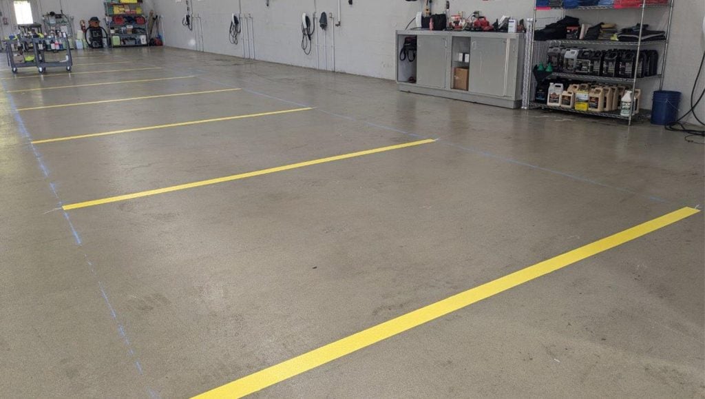 warehouse markings freshly painted for Tesla Dealership