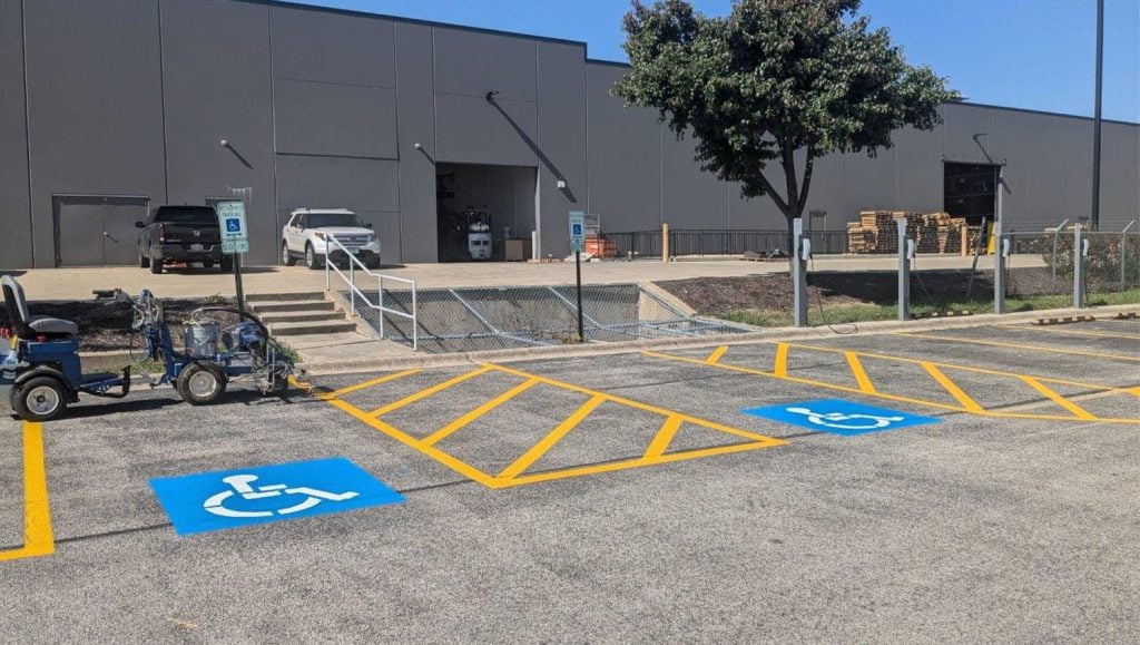 ada compliance parking spots freshly painted for Tesla Dealership parking lot