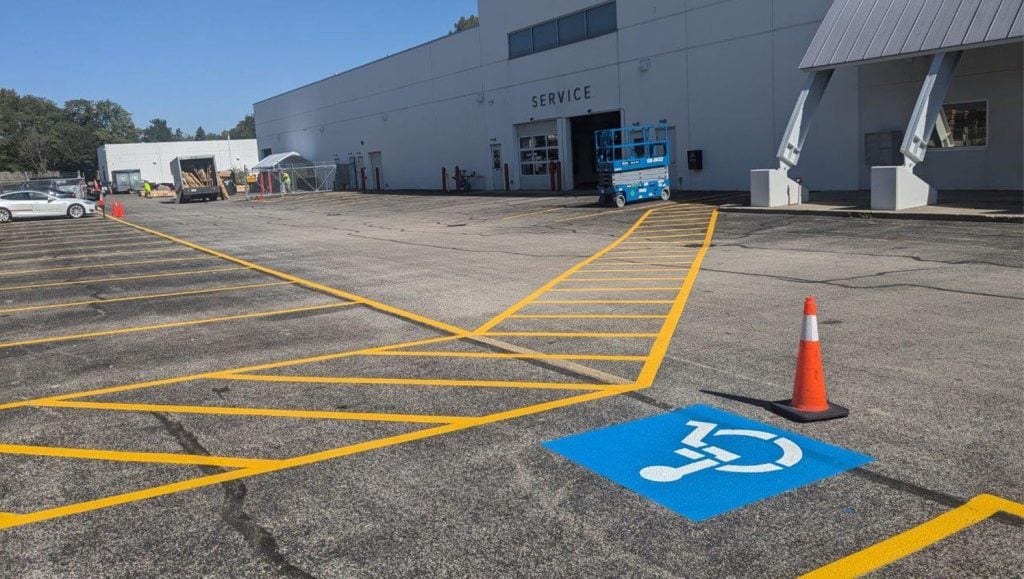 line markings freshly painted for Tesla Dealership parking lot