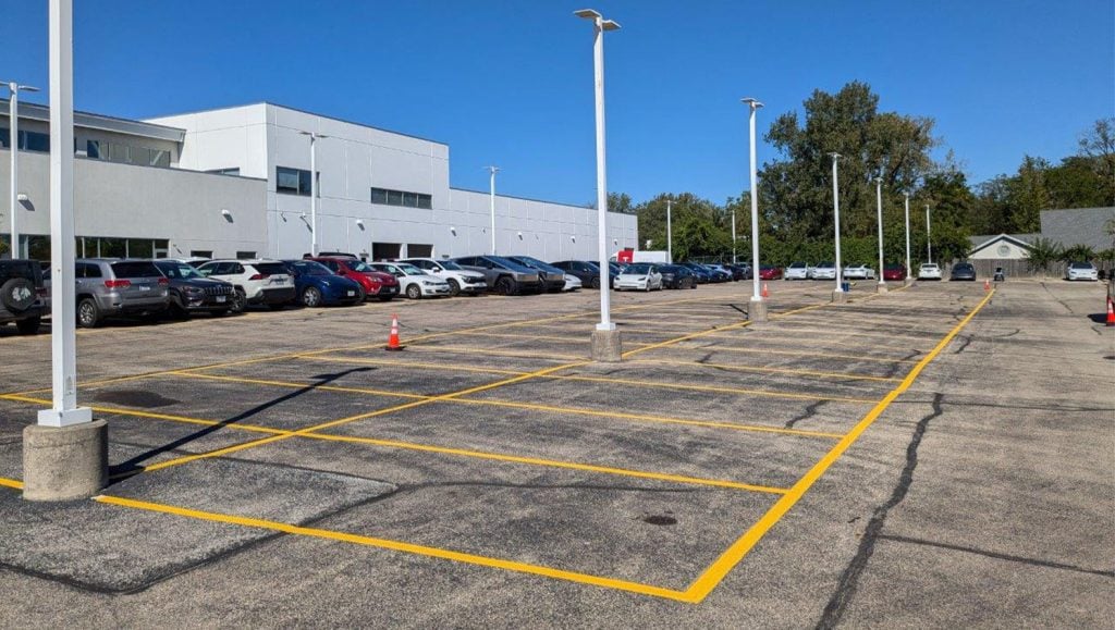 freshly painted parking spots for Tesla Dealership