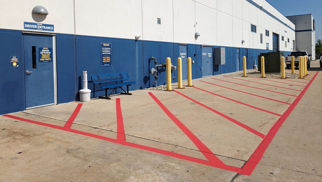 red line markings freshly painted for Werner Transportation parking lot