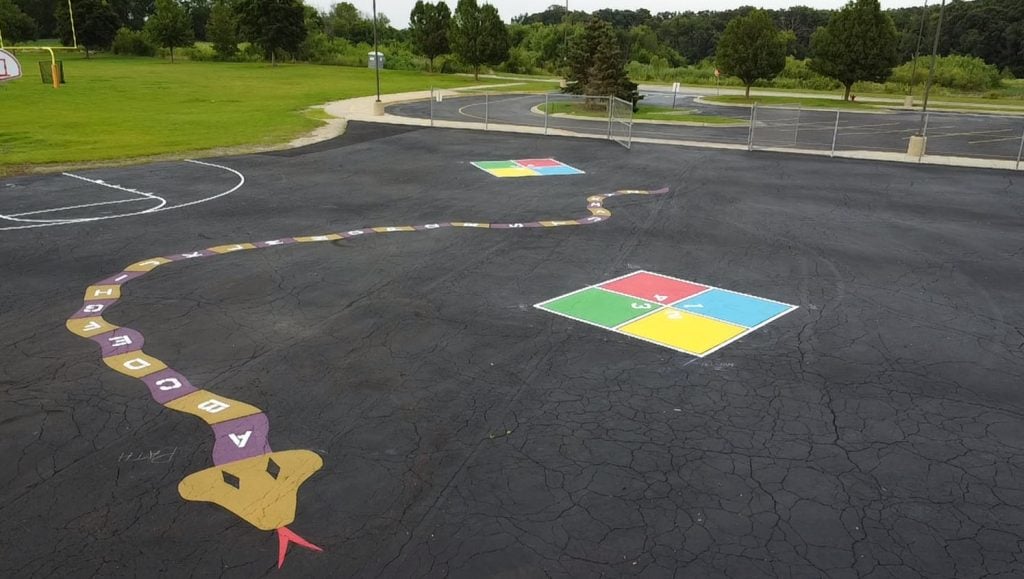 close-up of freshly painted line markings for Gilberts Elementary School parking lot