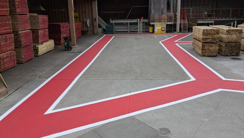 close-up of freshly painted line striping for Great Northern Lumber parking lot
