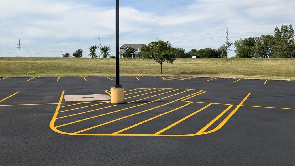 yellow lines freshly painted for Mendota High School parking lot