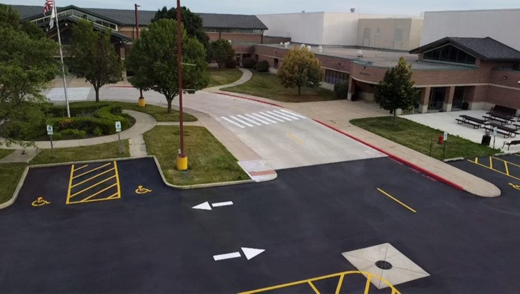 aerial view of Mendota High School parking lot freshly painted