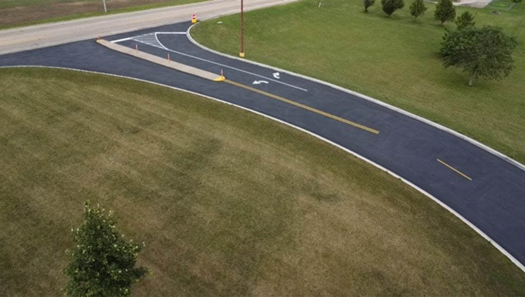 front entrance of Mendota High School parking lot freshly painted