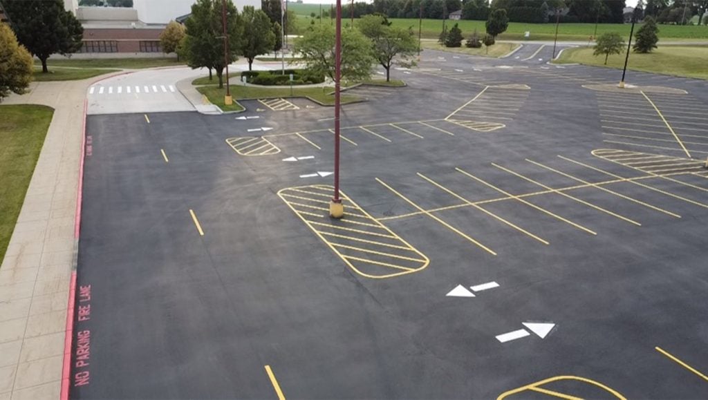 freshly painted line striping for Mendota High School parking lot aerial view