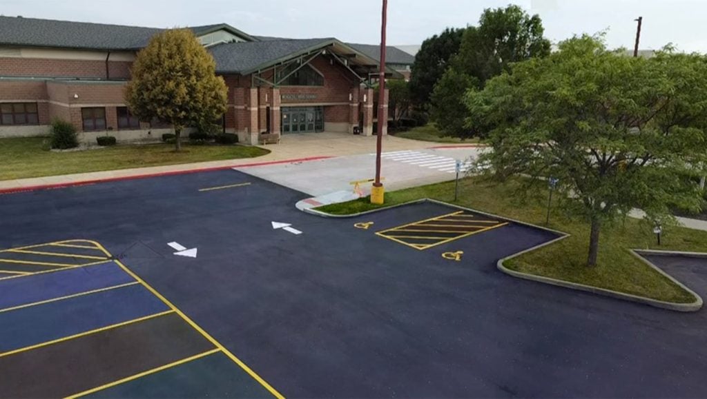 aerial view of Mendota High School parking lot freshly painted