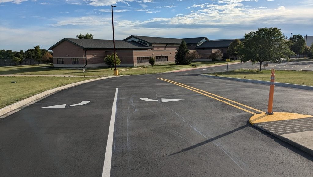 white and yellow line striping for Mendota High School parking lot