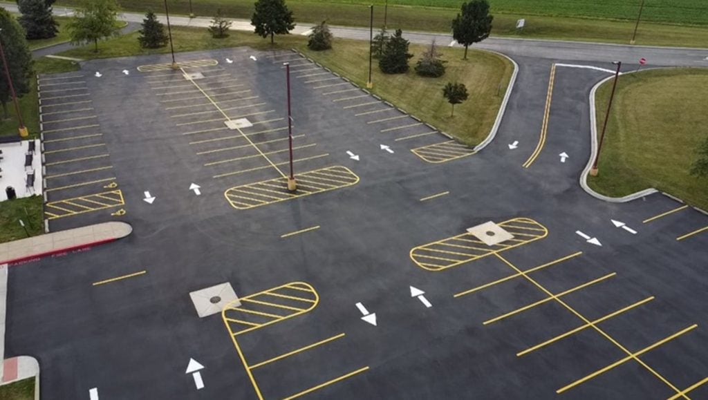 aerial view of Mendota High School parking lot with freshly painted line striping