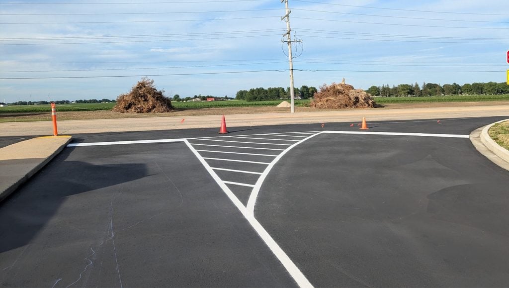 freshly painted line markings for Mendota High School parking lot