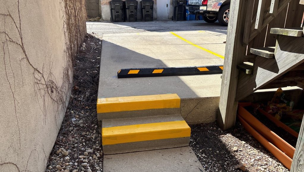 freshly painted line markings for St. Paul Condominium Association parking lot
