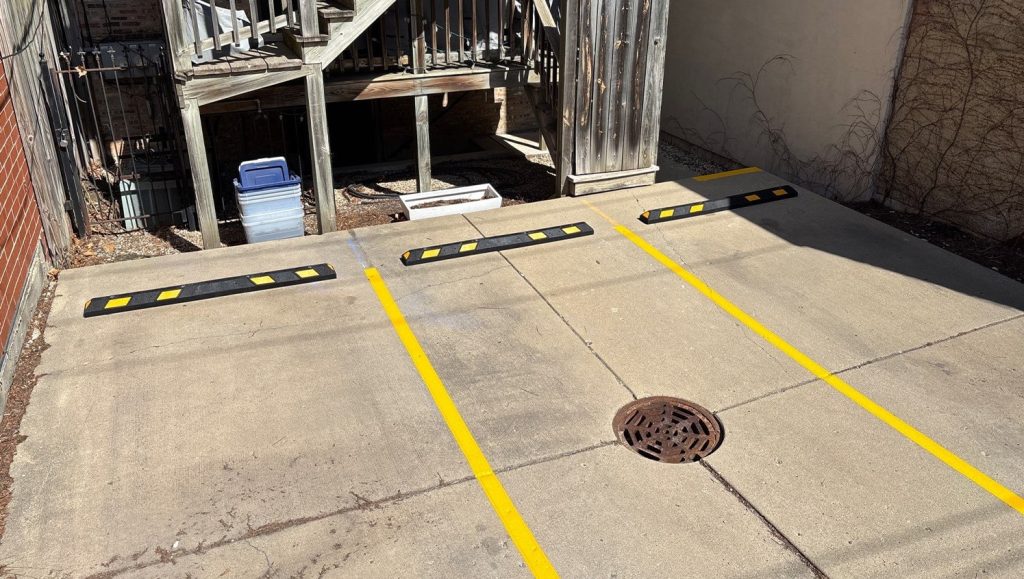 parking spots freshly painted for St. Paul Condominium Association parking lot
