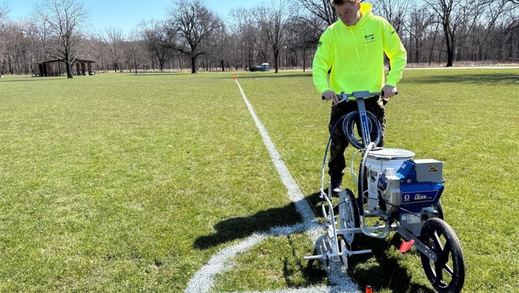 G-FORCE® employee line striping athletic field for Assyrian National Council of Illinois