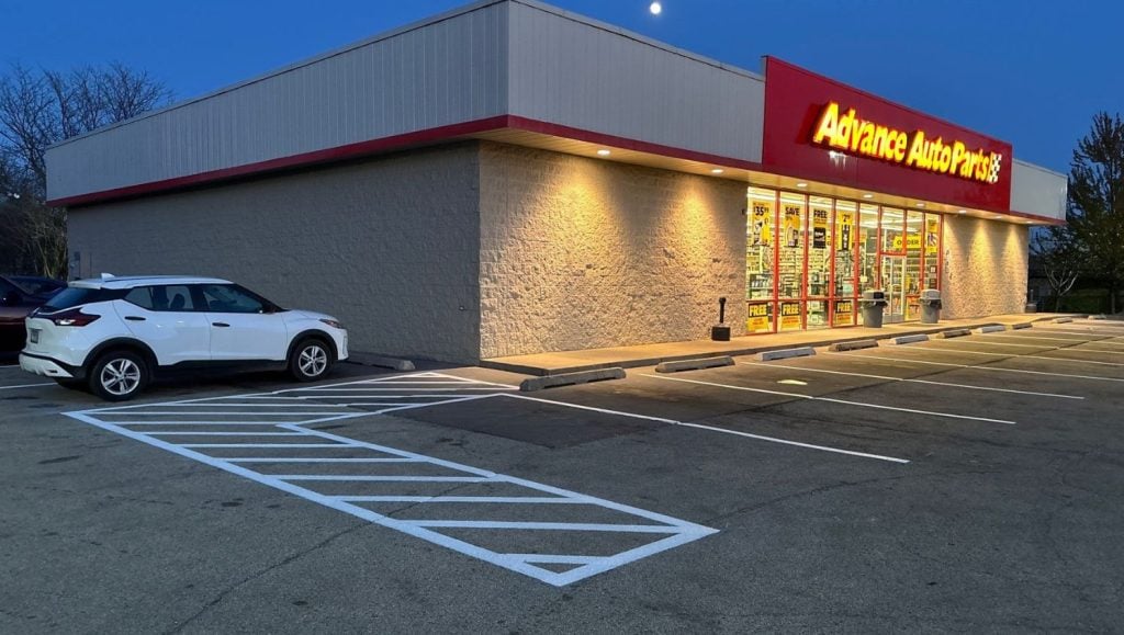 side view of Advance Auto Parts parking lot freshly painted
