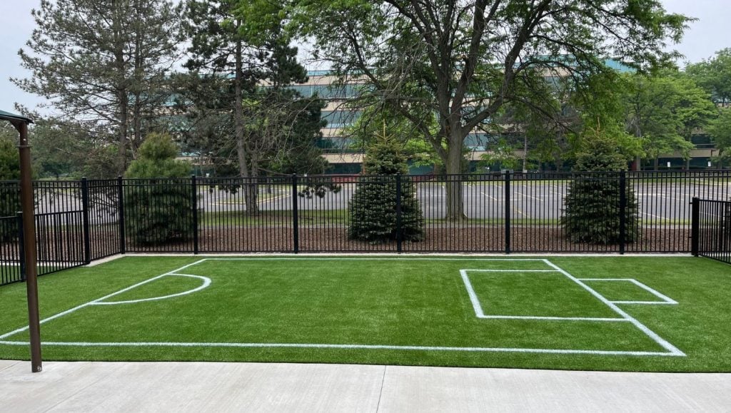 front view of a freshly painted athletic field for kindercare