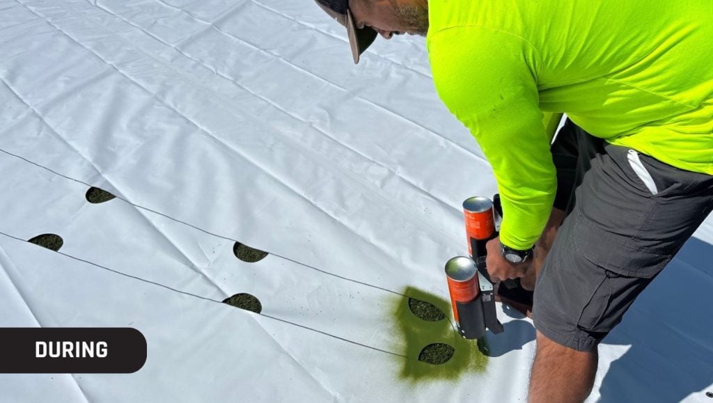 close-up of g-force employee installing new logo