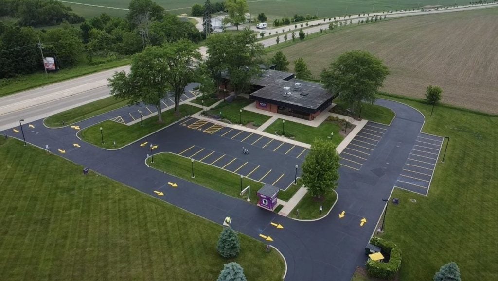 aerial view of Advia Credit Union parking lot freshly painted