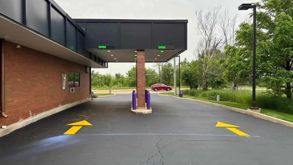 freshly painted arrows for Advia Credit Union parking lot