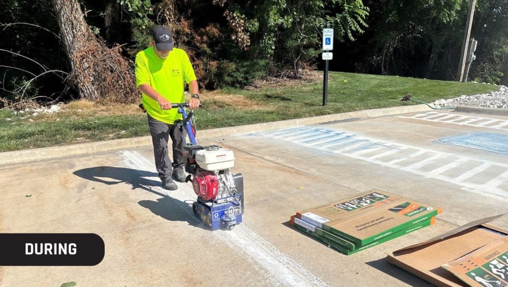 g-force employee using machine to grind concrete