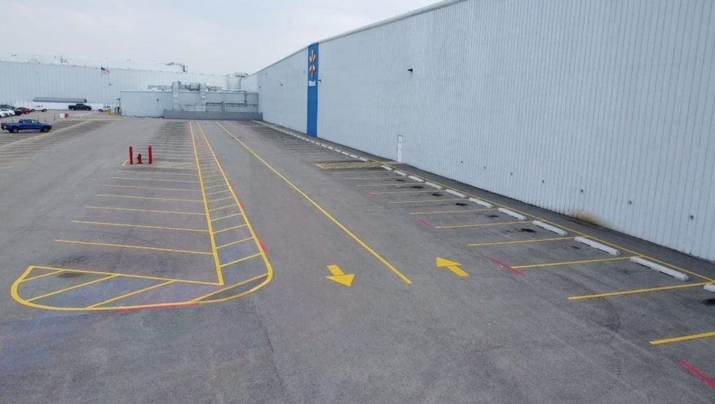 freshly painted arrows on Walmart Distribution Center parking lot