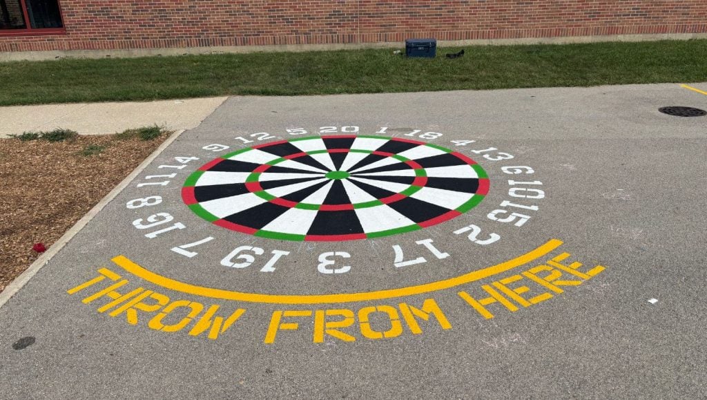 close-up of freshly painted line markings for. Kingsley Elementary School playground