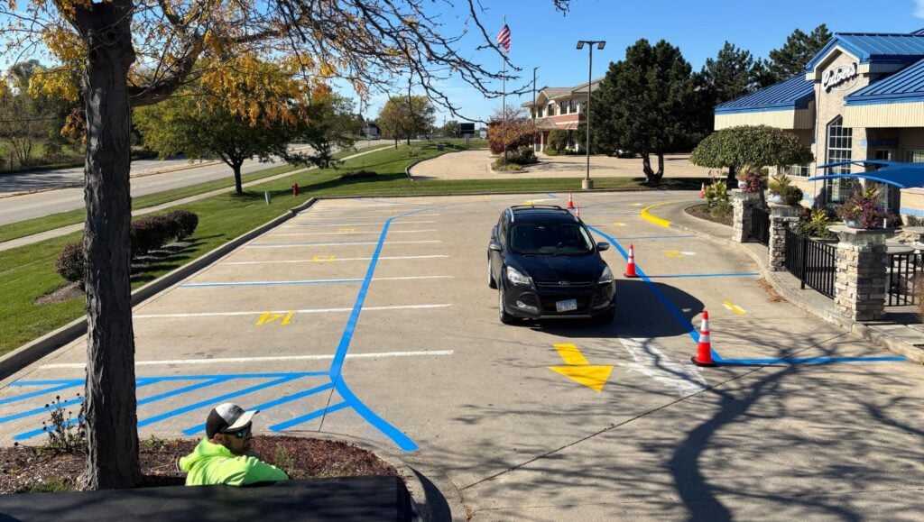 blue and yellow line markings freshly painted for Culvers parking lot
