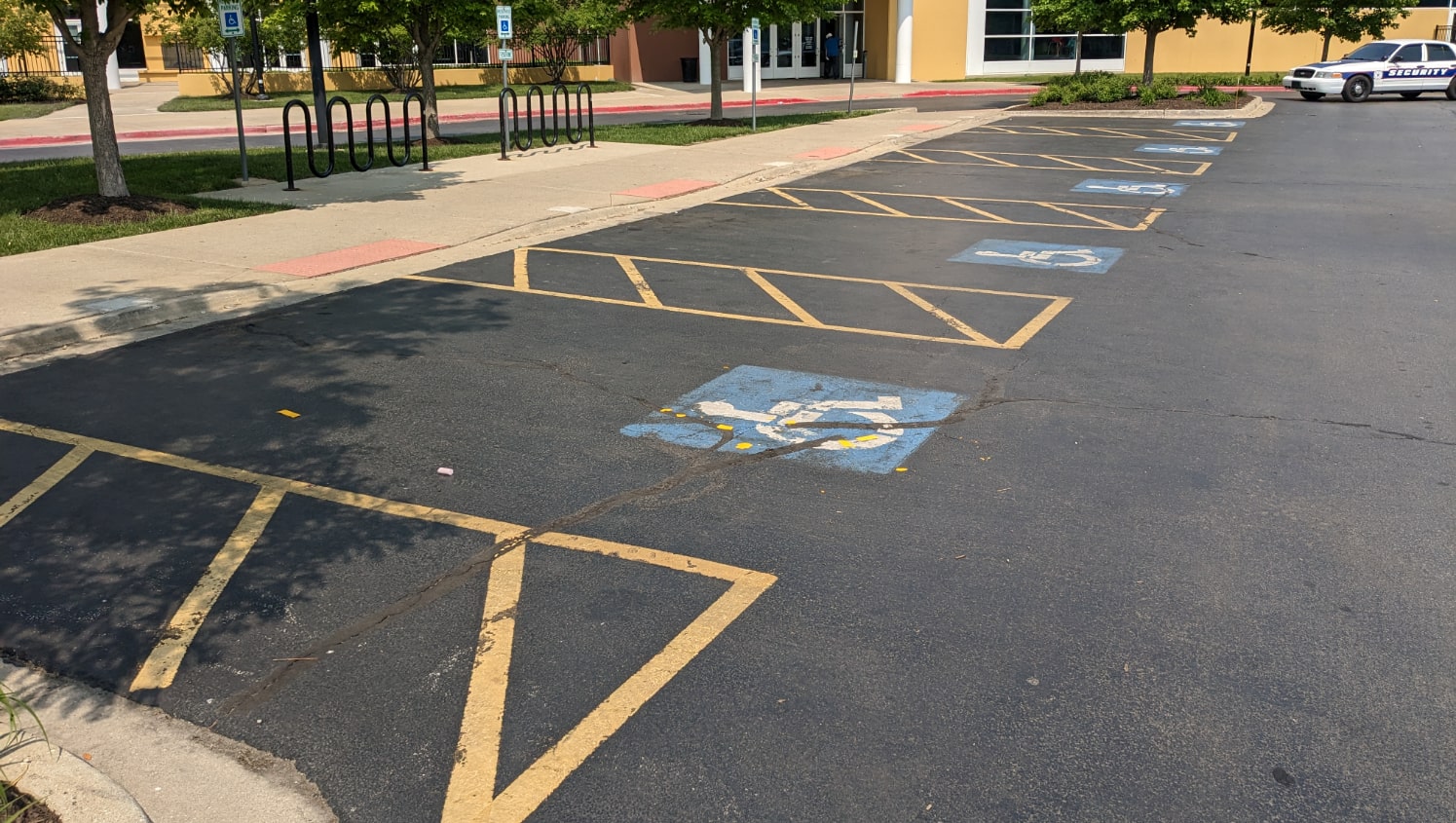 worn handicapped parking spaces awaiting repainting