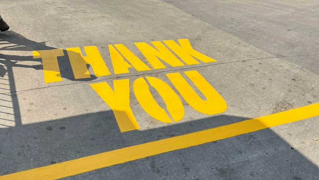 thank you freshly painted on McDonald's Northern Kentucky parking lot