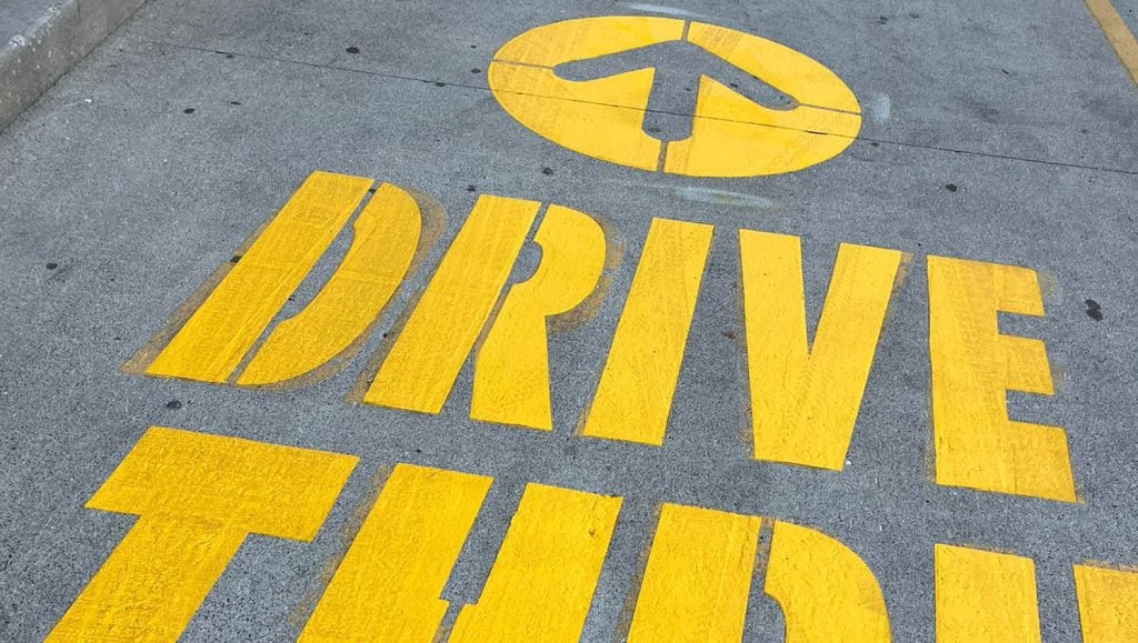 close-up freshly painted "drive thru" painted on McDonald's Northern Kentucky parking lot