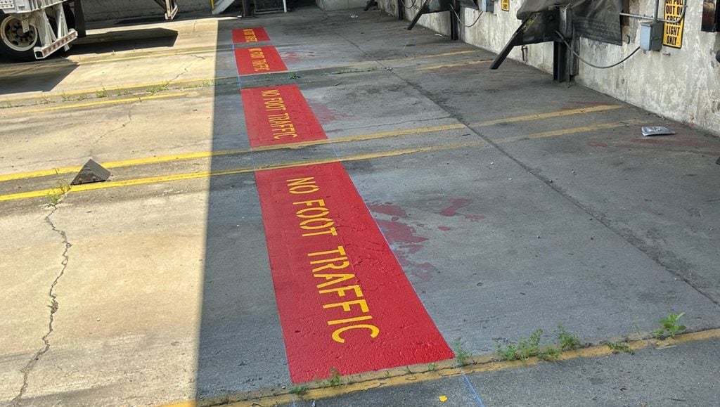 freshly painted no foot traffic on Valvoline parking lot
