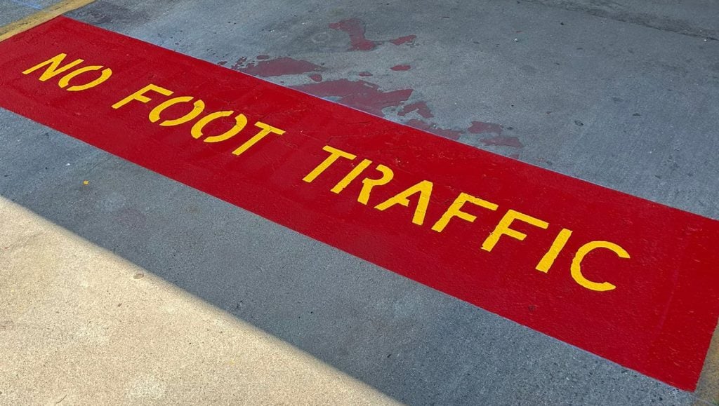 no foot traffic painting on Valvoline parking lot