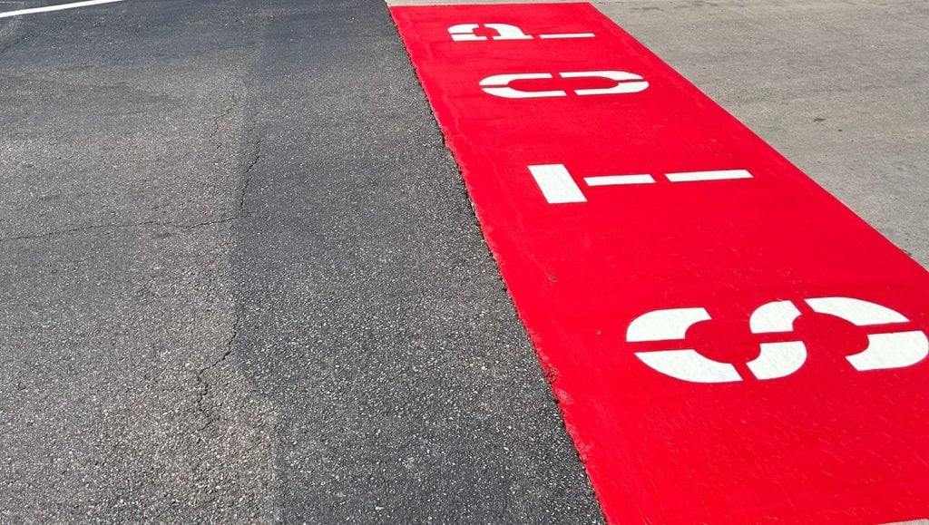 no foot traffic painted in red on Valvoline parking lot