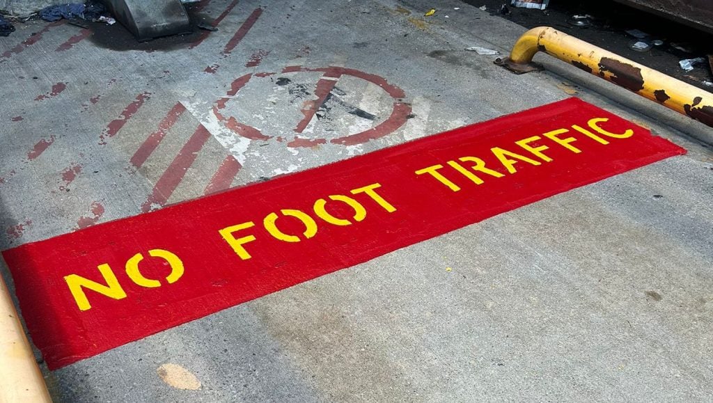 red "stop" line markings on Valvoline parking lot