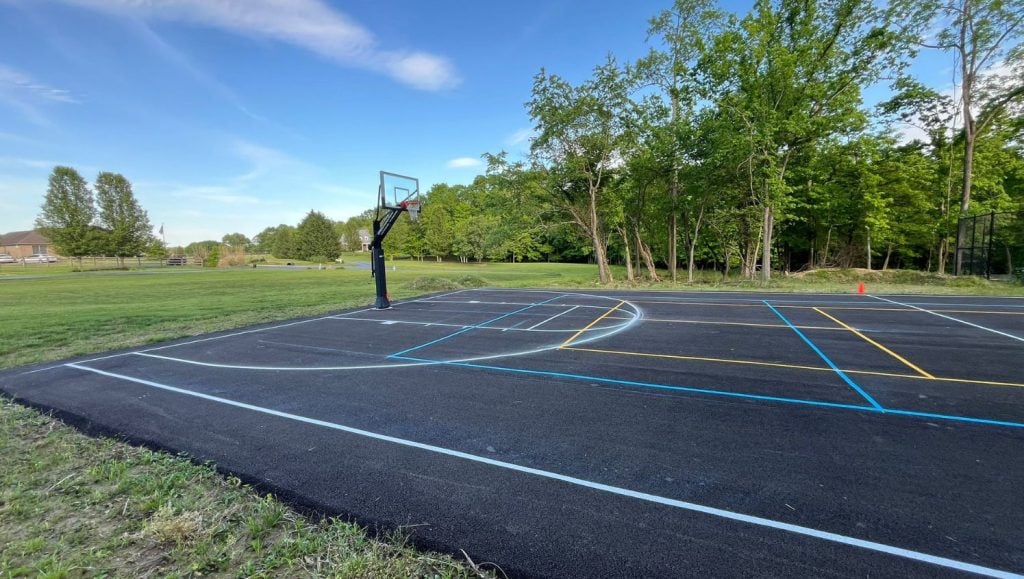 Private Residence court with freshly painted athleltic field markings