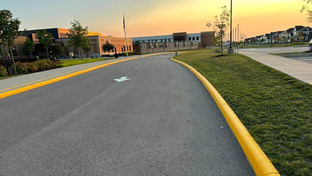 white arrow freshly painted on Dublin City Schools parking lot