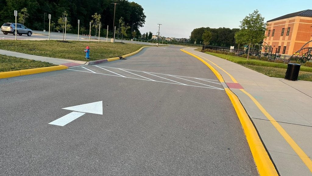 freshly painted curb for Dublin City Schools parking lot