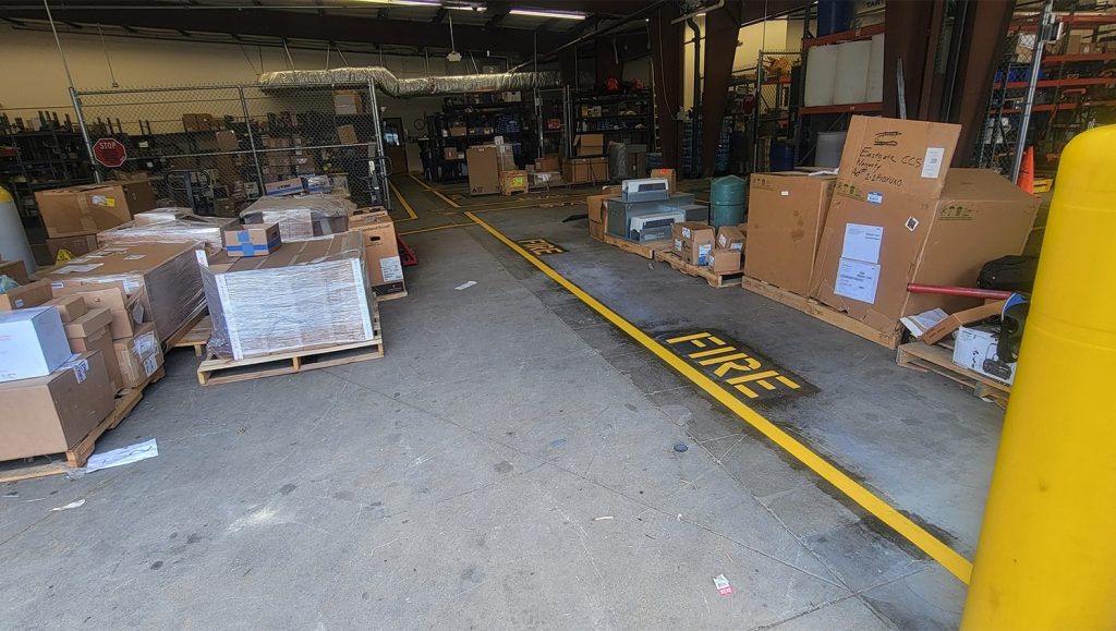 freshly painted yellow markings inside of warehouse