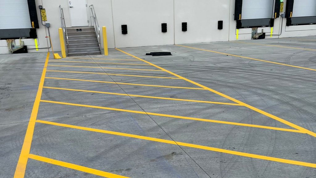 cross walk and freshly painted line markings for DB Schenker parking lot