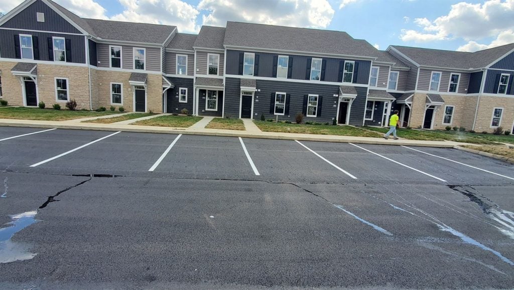 close-up of G-FORCE® employee line striping Fenimore Apartments parking lot