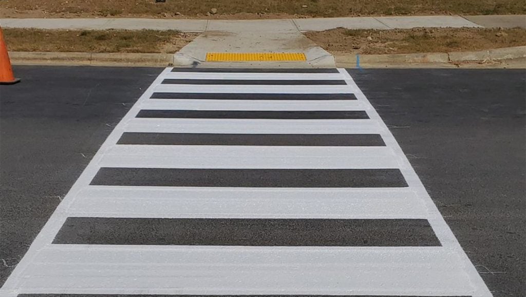 close-up of freshly painted crosswalk for Fenimore Apartments