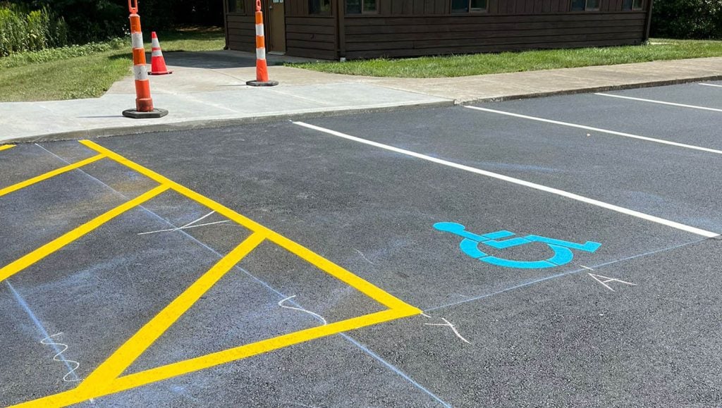 close-up of ada compliance parking spot and cross walking line markings