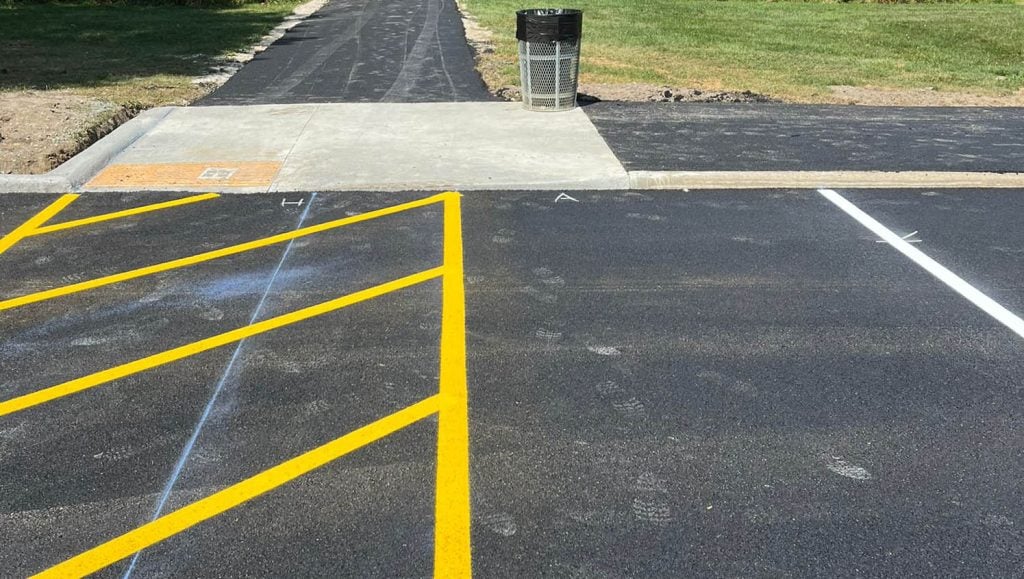 close-up of yellow cross walk freshly painted