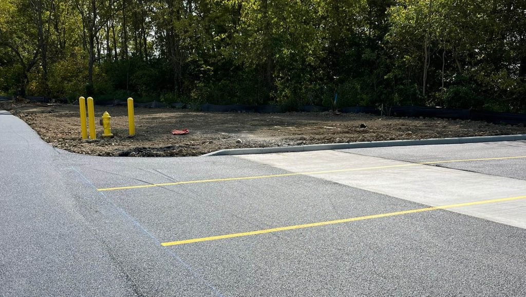 freshly painted yellow line markings for Shell Oil Company parking lot