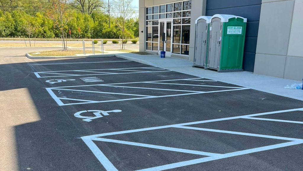 G-FORCE™ employees line striping Stelzer Road Warehouse