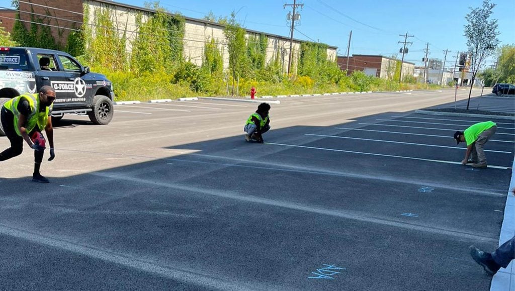 G-FORCE™ employees lining up line markings for Stelzer Road Warehouse