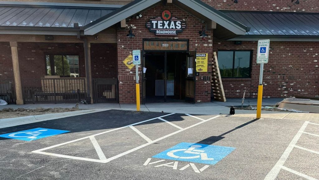 close-up of bollard installation for Texas Roadhouse