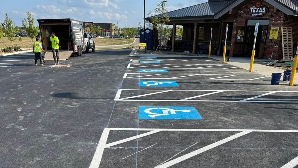 parking spots freshly painted for Texas Roadhouse parking lot
