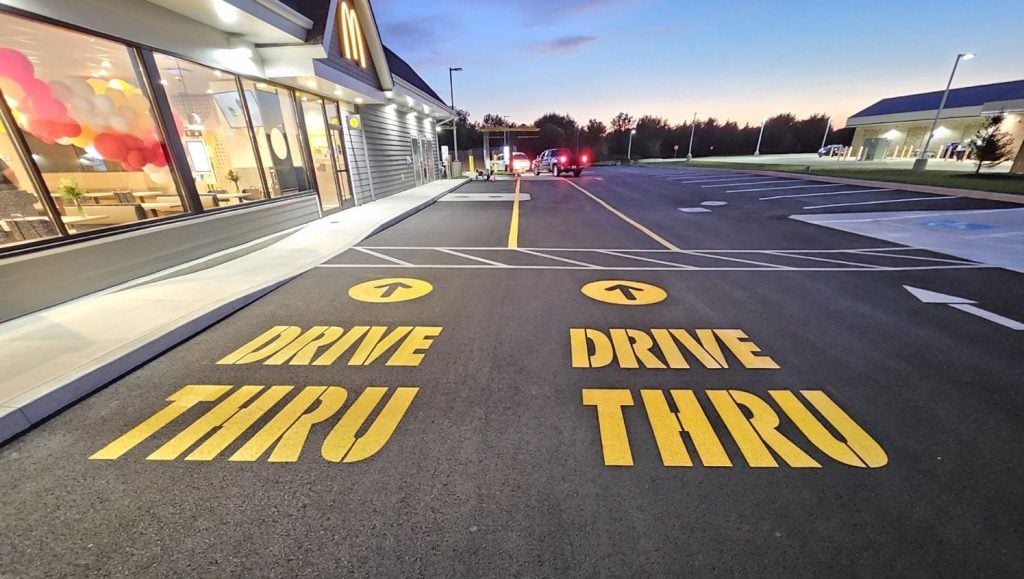thank you painted on Mcdonald's parking lot